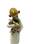 Lladro girl holding a baby goat