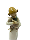Lladro girl holding a baby goat