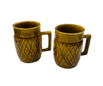 Pair of Crown Lynn honey glaze mugs