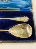 Pair of ornate silver plated serving spoons