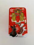 Rectangular Scottie Dog Tin in-front of a Christmas Door