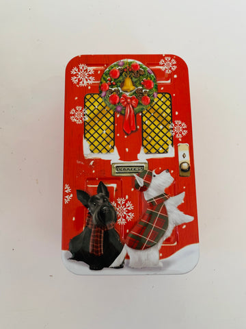 Rectangular Scottie Dog Tin in-front of a Christmas Door