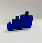 Set of 3 graduated vintage cobalt blue glass bottles