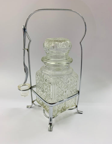 Vintage glass olive jar with fork