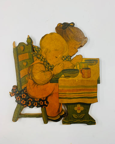 Vintage solid wood cut out of 2 children praying at the table