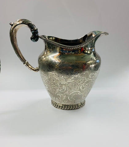 Large ornate silver plated water jug