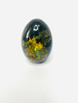 Decoupage Egg Black with Russian Lady Standing outside the city.