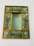 Small antique mirror with painted floral design