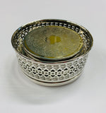 Set of 8 silver plated cup coasters in a holder